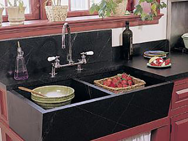 Rinsing strawberries in a Vermont Soapstone Windsor sink