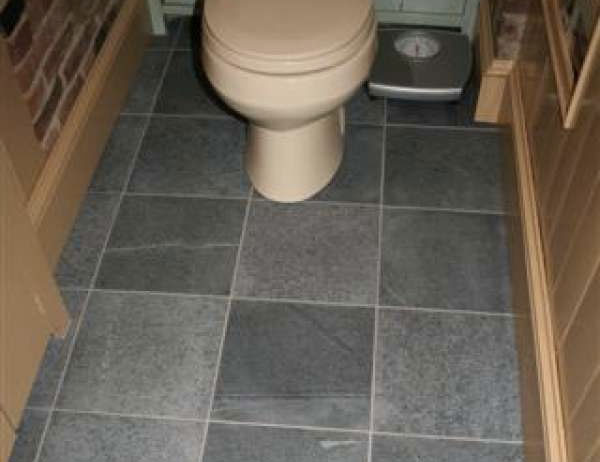  Vermont Soapstone manufactured and installed the flooring system in this lavatory.