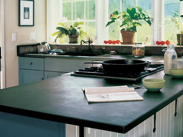 Vermont Soapstone countertops give this kitchen it's classic farmhouse look.