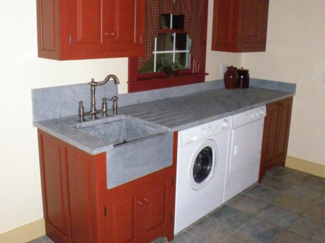 Vermont Soapstone countertop and deep sink make this a laundry room you'll like to spend time in.