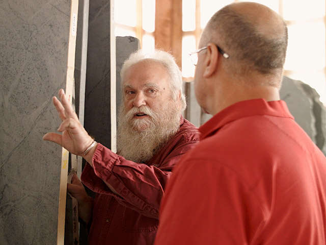 Customers choosing their unique soapstone slabs for a new custom kitchen