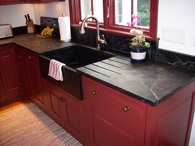 The countertop and splash guards were custom built to fit the customer's over-sized cupboards. Note the drain vents cut on the countertop to drain water into the deep Windsor Sink.