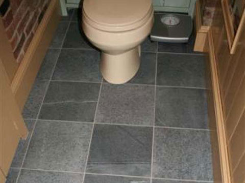 Bathroom designed with Vermont Soapstone tile flooring.