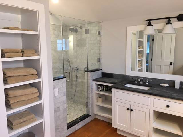 Vermont Soapstone accents on the shower surround tie-in nicely with the double vanity.