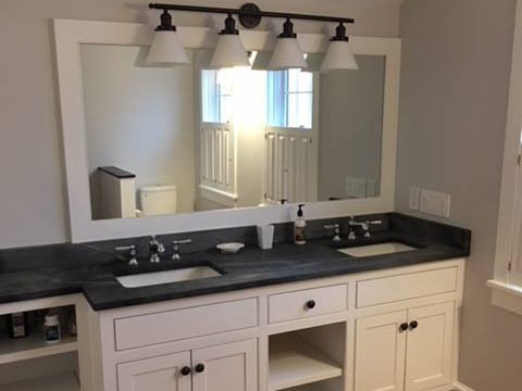 Vermont Soapstone counter and backsplash with inset porcelain sinks.