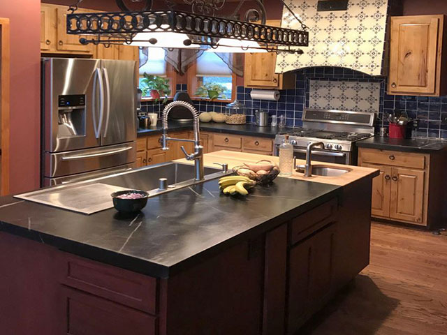 Vermont Soapstone combined with butcher block on an oversized kitchen island.