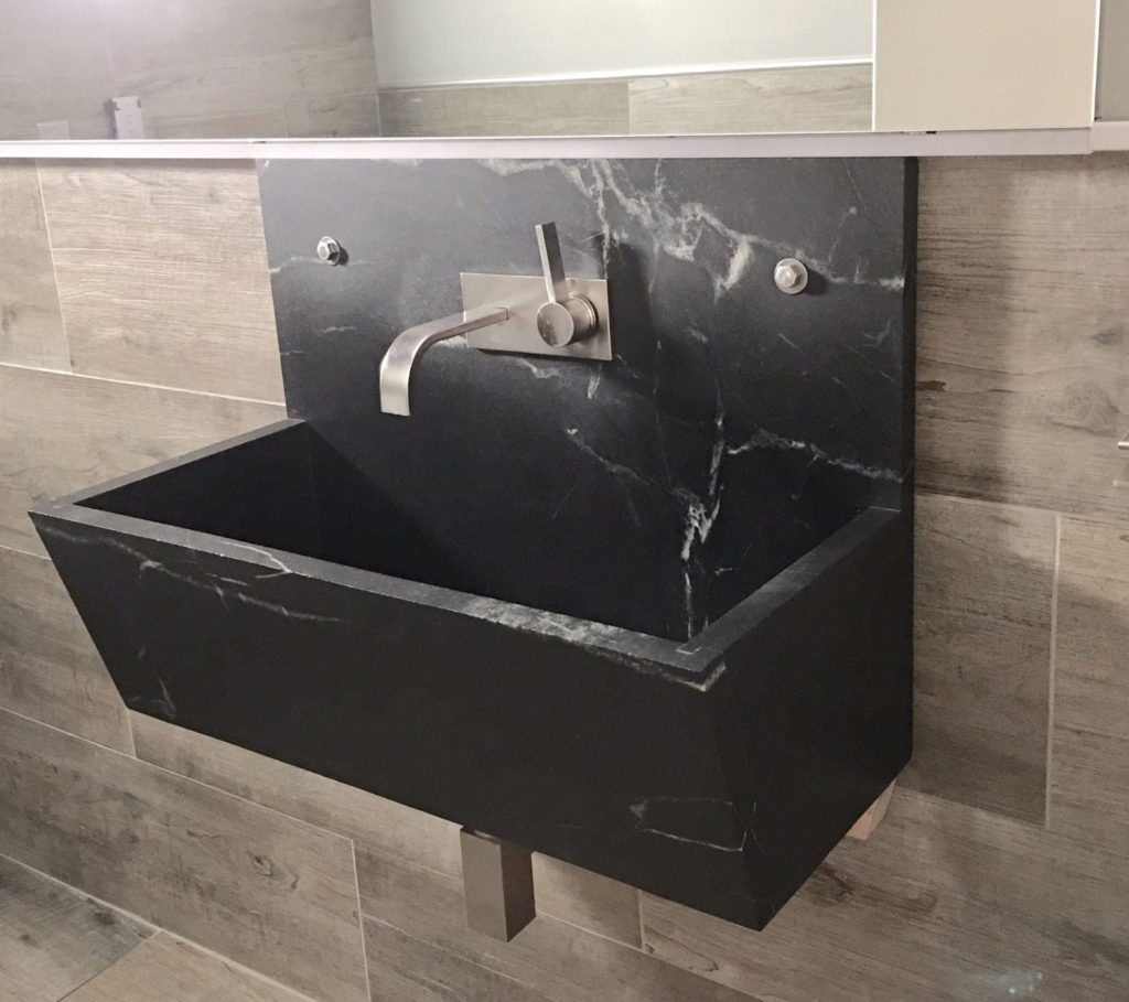 Custom wall lavatory shows how Vermont Soapstone can look great in a modern style bathroom.