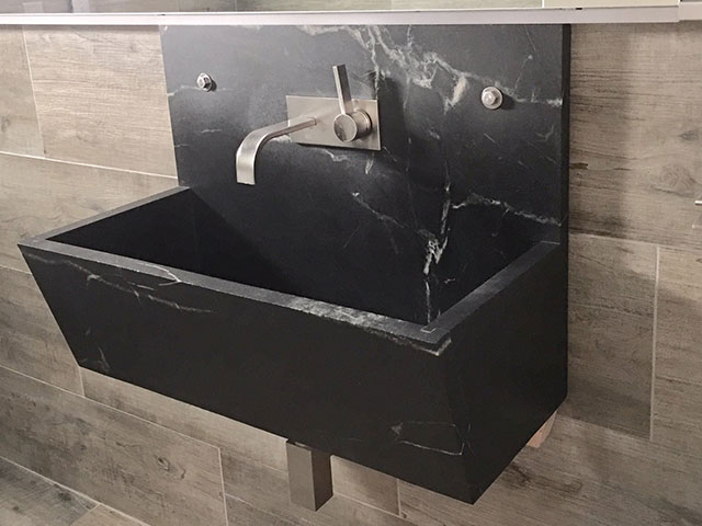 Custom wall lavatory shows how Vermont Soapstone can look great in a modern style bathroom.