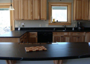 Vermont Soapstone can be worked like wood to create interesting custom shapes like this curved island top.