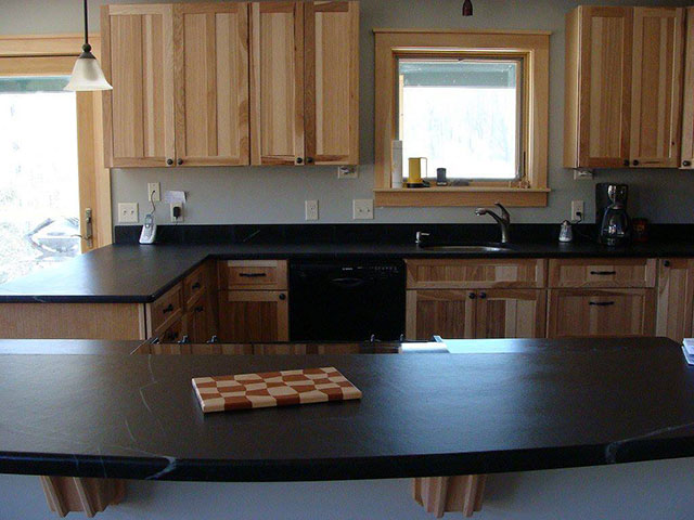 Vermont Soapstone can be worked like wood to create interesting custom shapes like this curved island top.