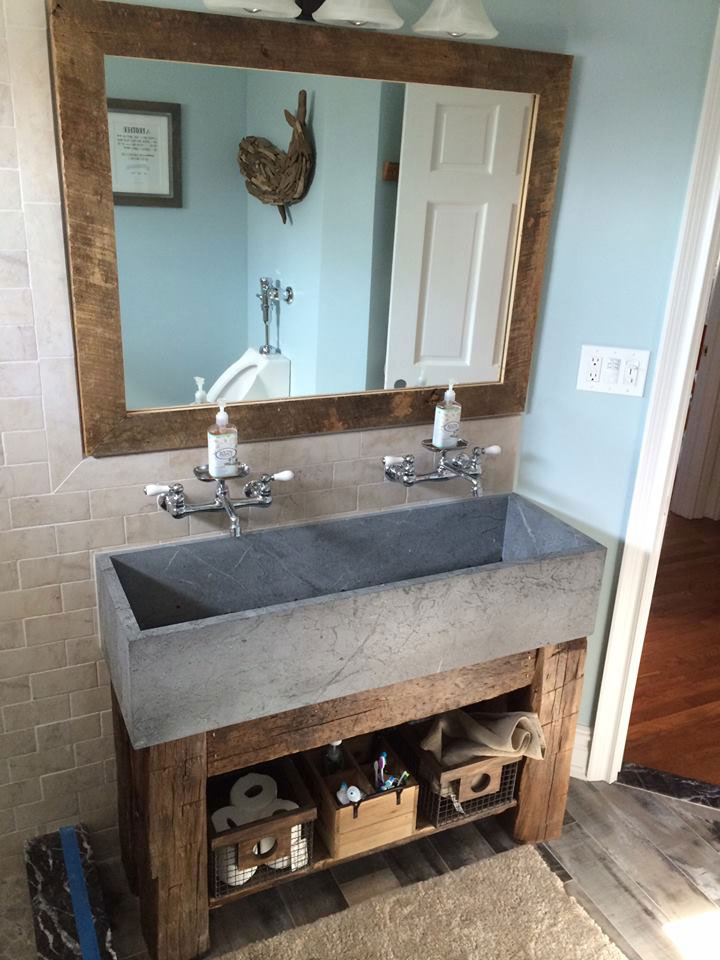 Unique extra-wide Vermont Soapstone lavatory fits perfectly in this rustic bathroom.