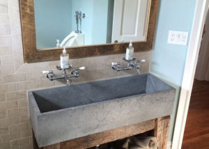 Unique extra-wide Vermont Soapstone lavatory fits perfectly in this rustic bathroom.