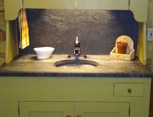 Unique Country Bathroom Features Soapstone Vanity and Flooring
